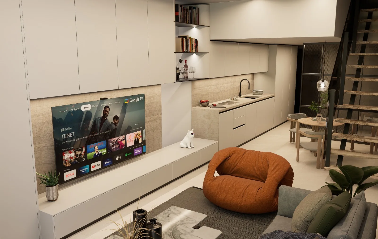 Open-plan living room and kitchenette with floor-to-ceiling cream cabinetry, integrated TV wall with stone surround, floating bookshelf niche, stone-topped sink unit, orange beanbag and floating staircase — KITWOOD Lebanon interior design
