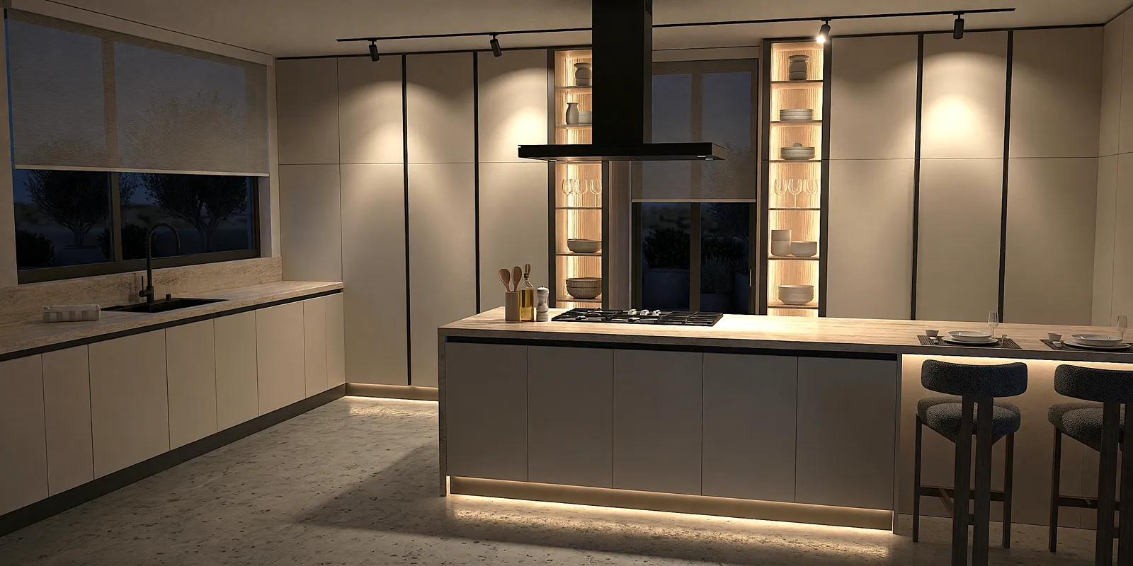Contemporary evening-view kitchen with beige matte handleless floor-to-ceiling cabinetry, dark grey wood island with light oak top, sculptural black island extractor hood, twin light oak LED-lit recessed display columns flanking a picture window, travertine perimeter countertop with undermount sink and matt black mixer tap, LED toe-kick lighting and boucle bar stools on polished travertine flooring — KITWOOD Lebanon design