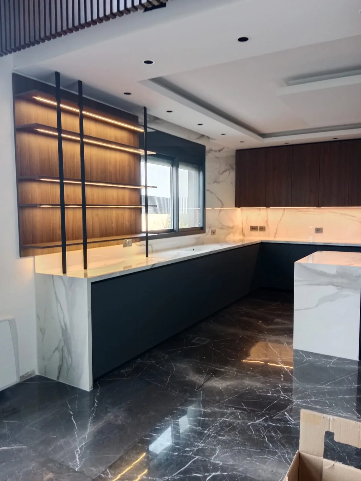 AS kitchen executed in Achrafieh, Beirut — walnut LED-lit floating display shelves with Calacatta marble waterfall island — KITWOOD completed project